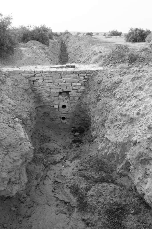 Khadin-A Nature-Based Solution for Water for Agriculture in Thar Desert, Jaisalmer district, Rajasthan - An outlet for draining out the impounded water from Masurdi Khadin